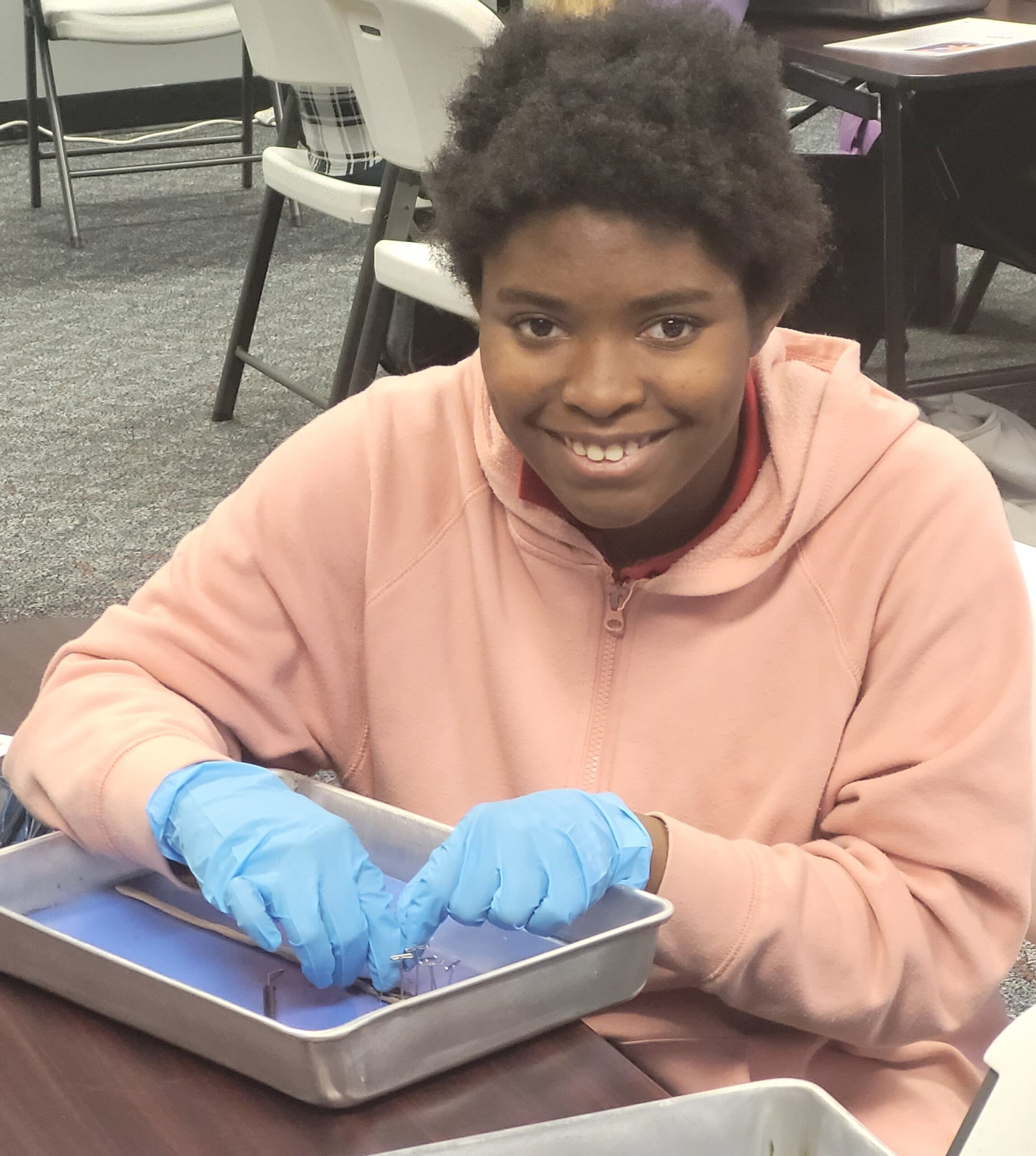 Girl with dissection tray