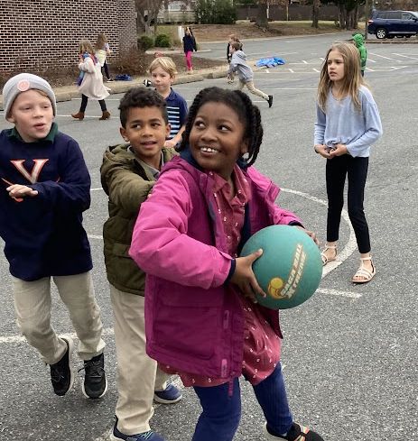 Children play with a ball at recess